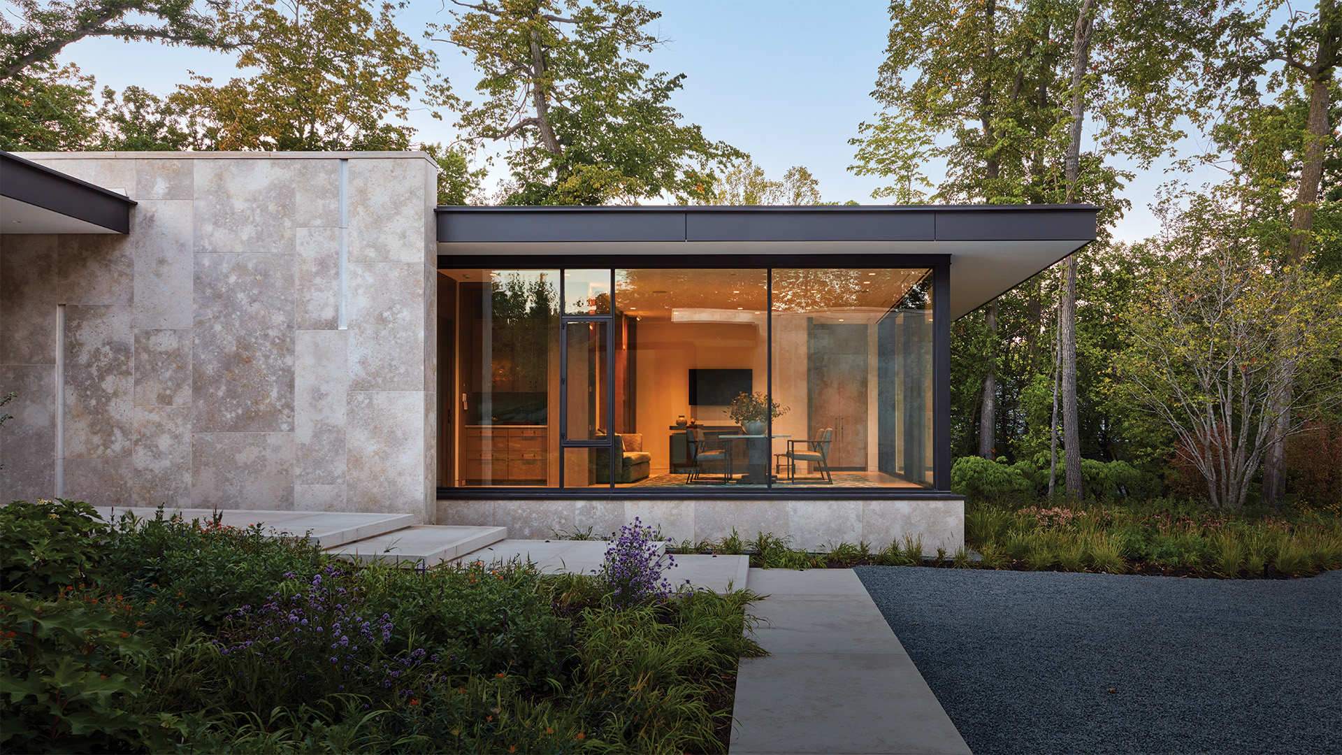 Hope's windows featured on a high-end home surrounded by an outdoor pool and plants.