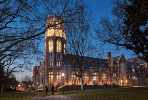 College campus building lit at night, highlighted by new Hopes Windows and Doors.