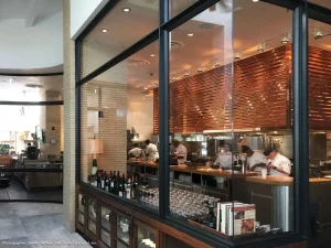 Upscale restaurant with Hopes hurricane safe steel windows, Hillstone at Bal Harbour, Florida.