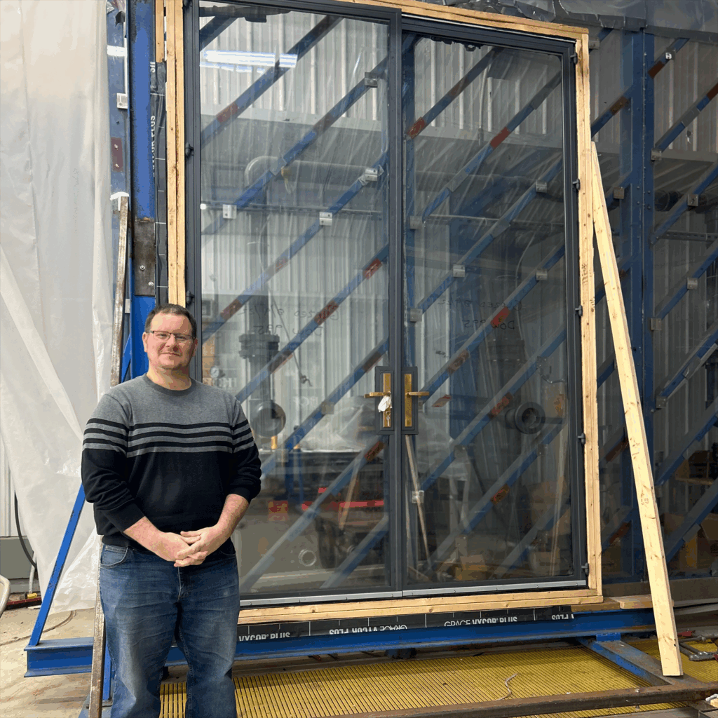 Hope’s Senior Research and Design Engineer Ryan Carlson shown along side of one of several Hope’s test specimens.