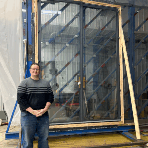 Hope’s Senior Research and Design Engineer Ryan Carlson shown along side of one of several Hope’s test specimens.