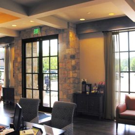 Interior lobby view of Hopes steel doors and windows that let in natural light, Iberia Bank.