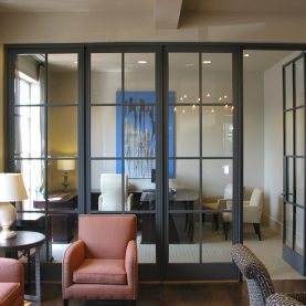 Interior view of Hopes steel door and window wall that separates office space, Iberia Bank.