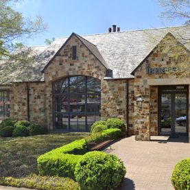 Stone bank building with Hopes steel windows & doors, exterior front entrance view, Iberia-Bank.