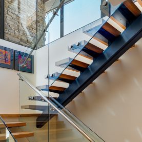 Hopes custom windows on dramatic staircase of a high-end Arizona home.