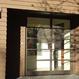 Residential entrance with Landmark175 Series steel swing door with sidelite