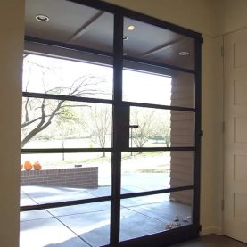 Hopes Windows Landmark175 Series steel swing door with sidelite.