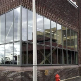 Urban Outfitters brick building close up, highlighted by new Hopes Windows and Doors.