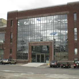 Urban Outfitters brick building entrance, highlighted by new Hopes Windows and Doors.